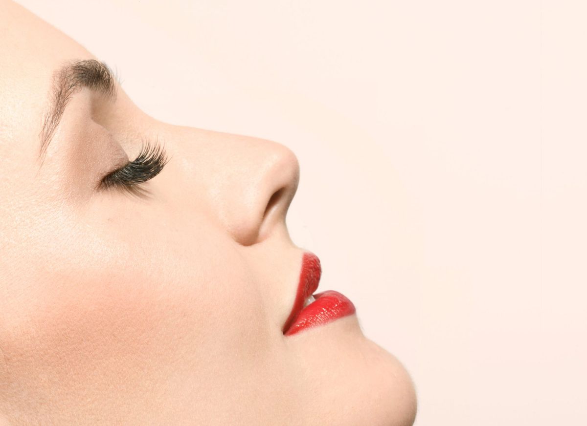 Woman with Red Lipstick and Long Lashes