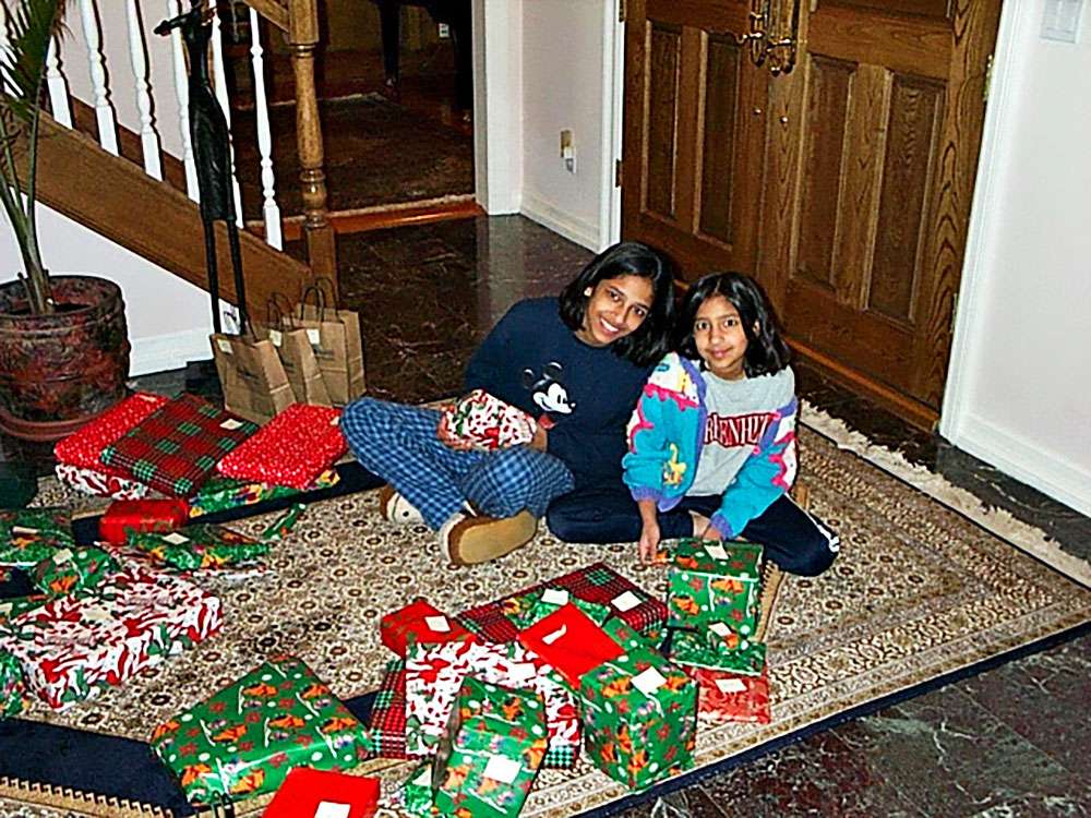 Writer Priya Krishna and her sister Meera opening presents on Christmas Day