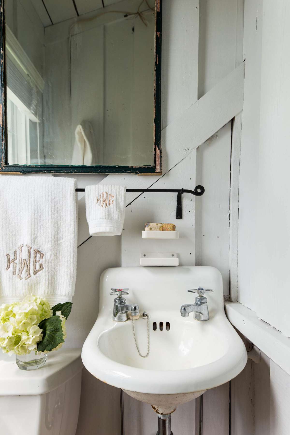 Small bathroom with white walls and old sink
