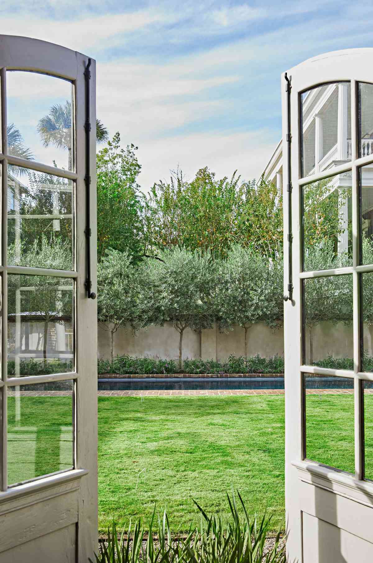 French Doors opening onto a grassy lawn