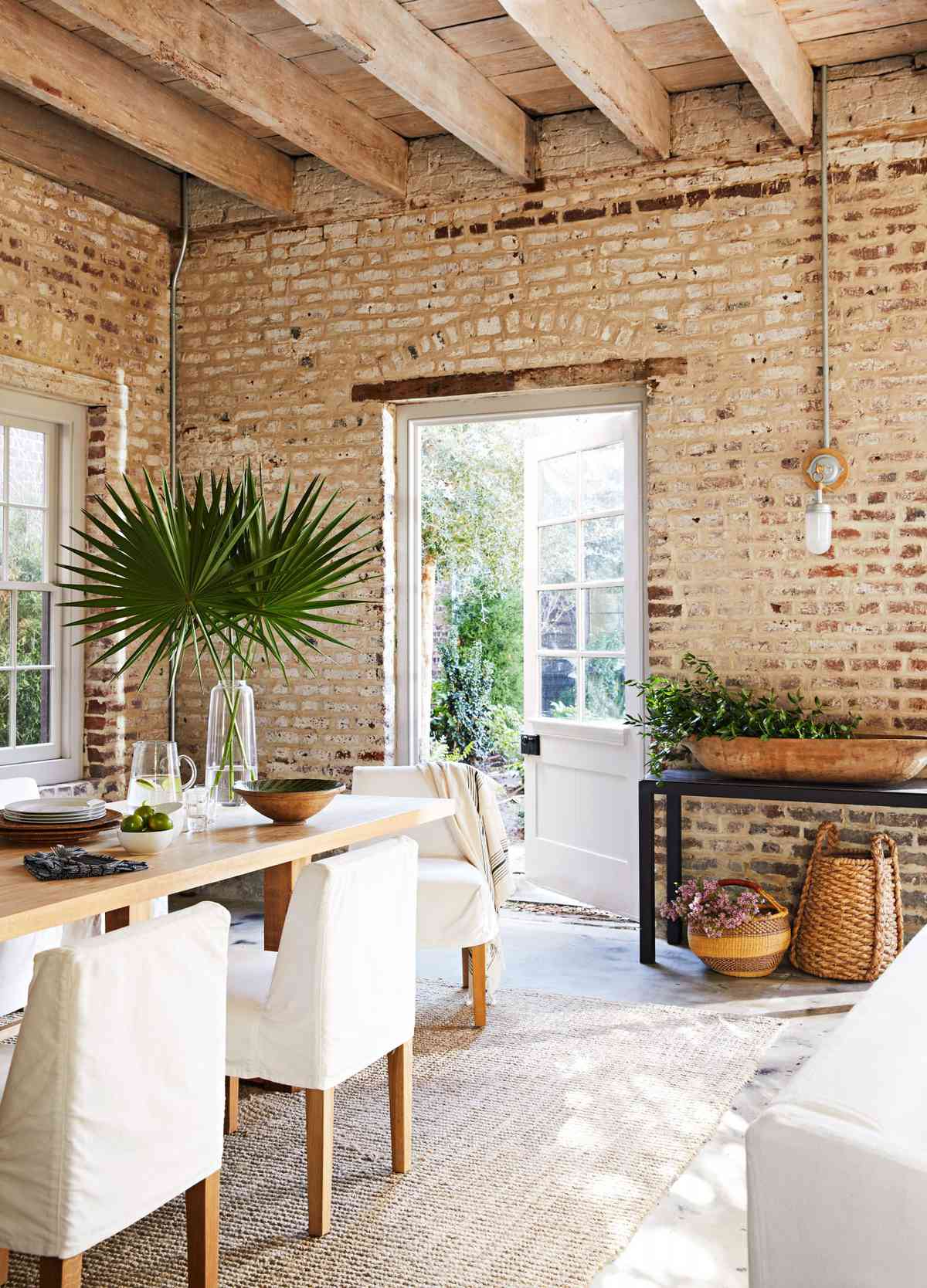 Brick walled dining room in historic carriage house