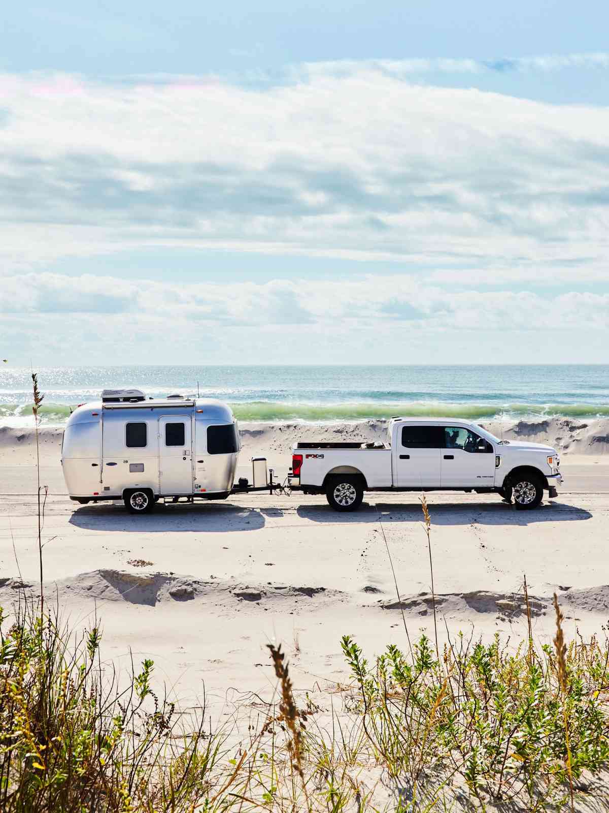 Truck and Airstream Bambi on sands of Ocracoke Island, NC