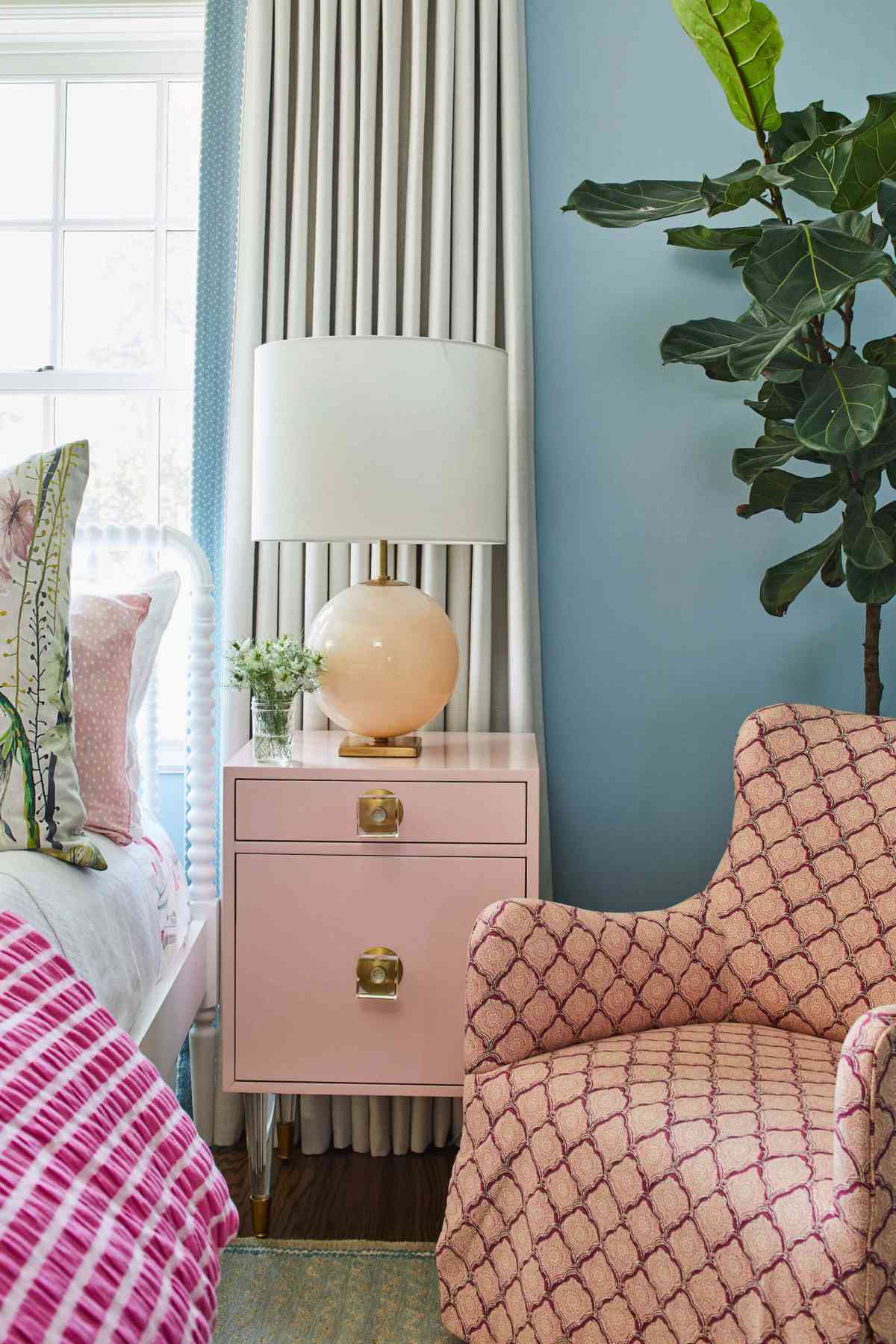 Pink bedside table with classic drum lampshade and pink lamp