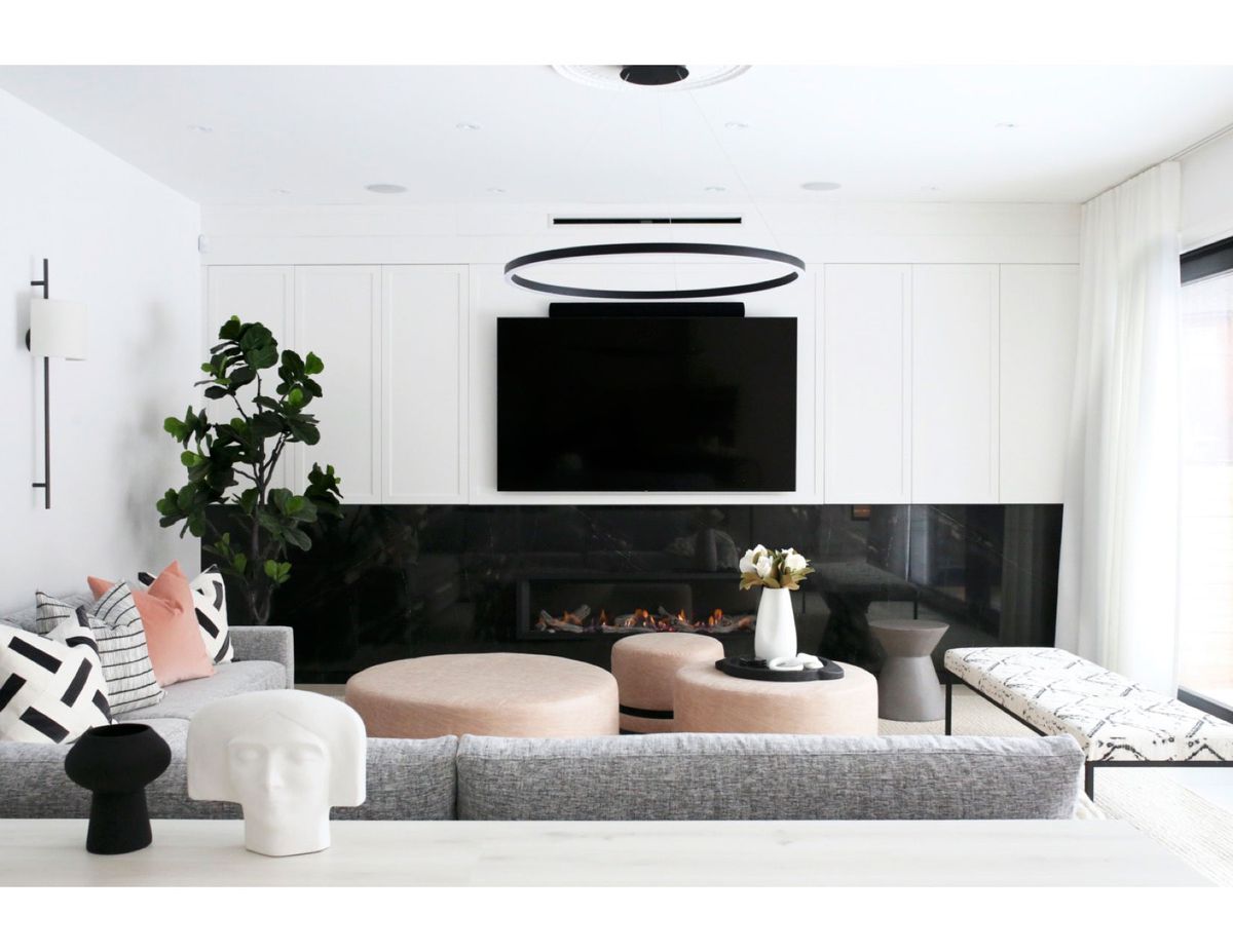 White Living Room with Black Granite Fireplace