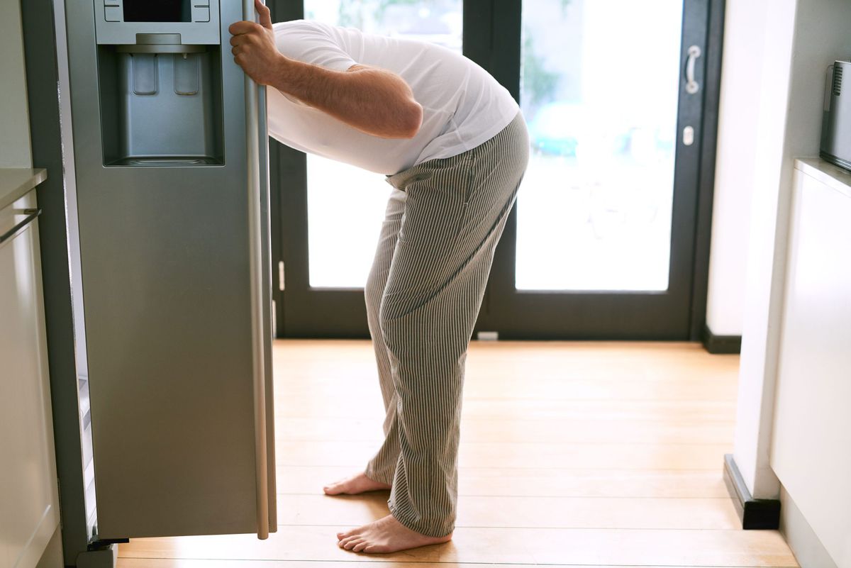 Man With Head Sticking Out of the Refrigerator