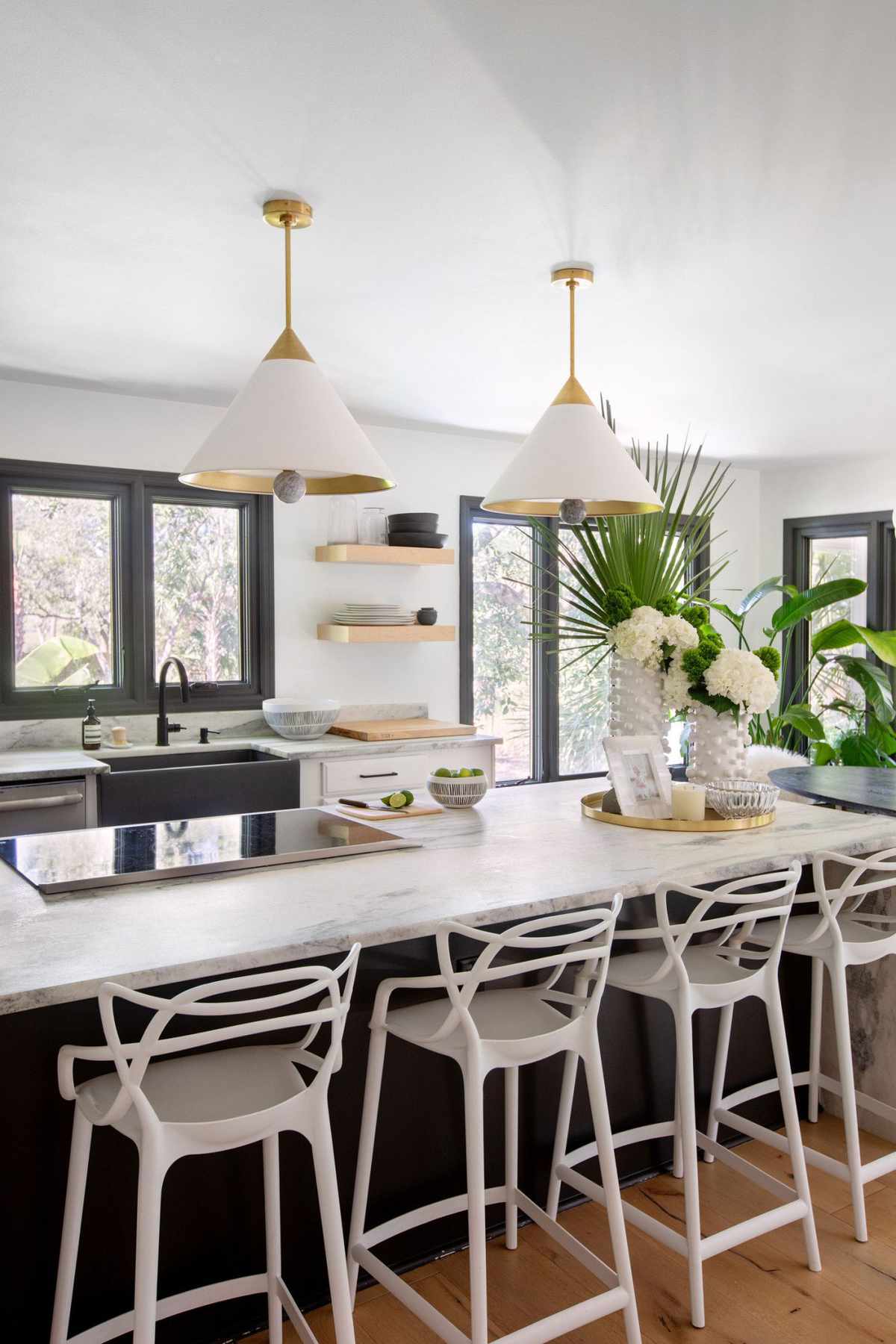 Black and White Kitchen with Dome Pendants Over the Island