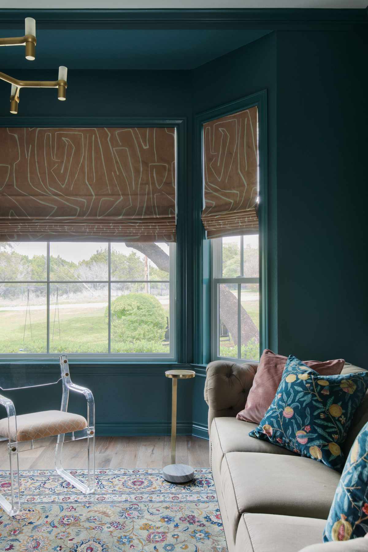 Green Room with Roman Shades and Large Windows