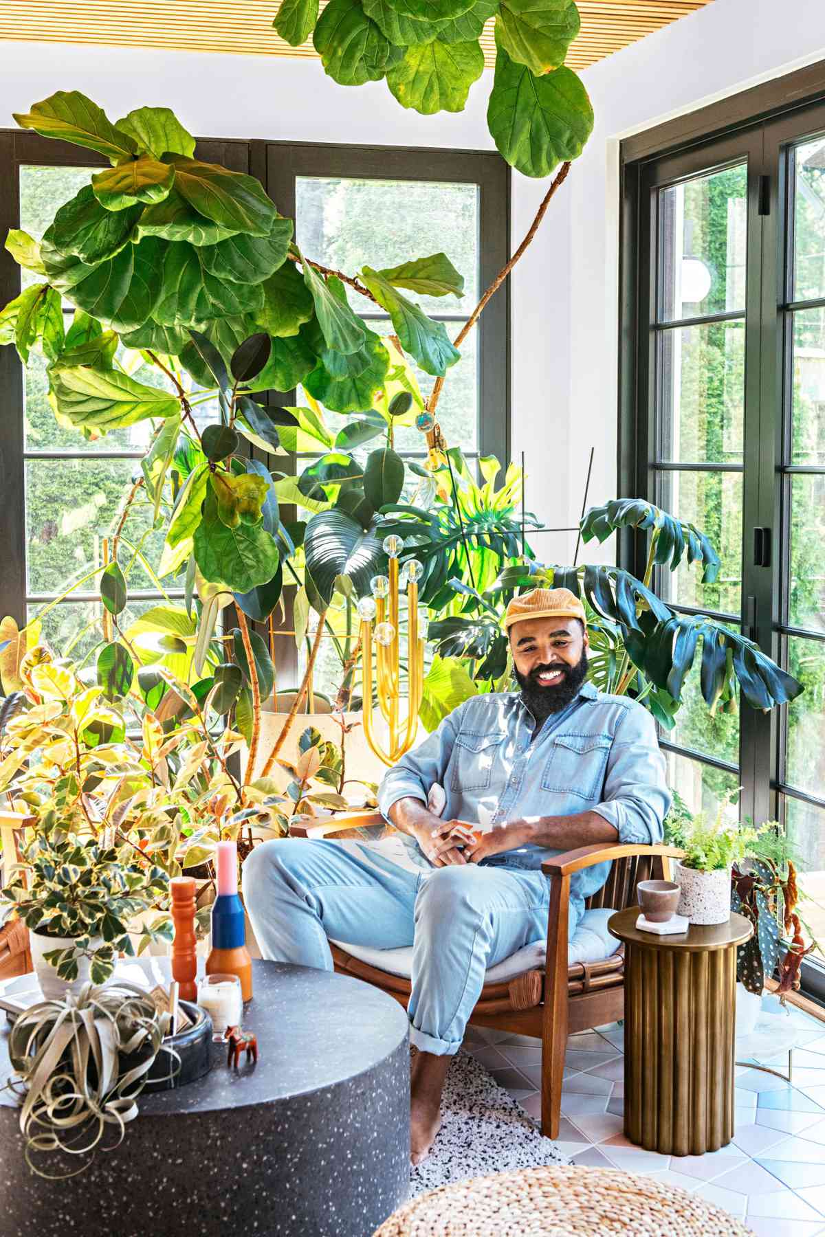 Hilton Carter at home in Baltimore, MD with his houseplants