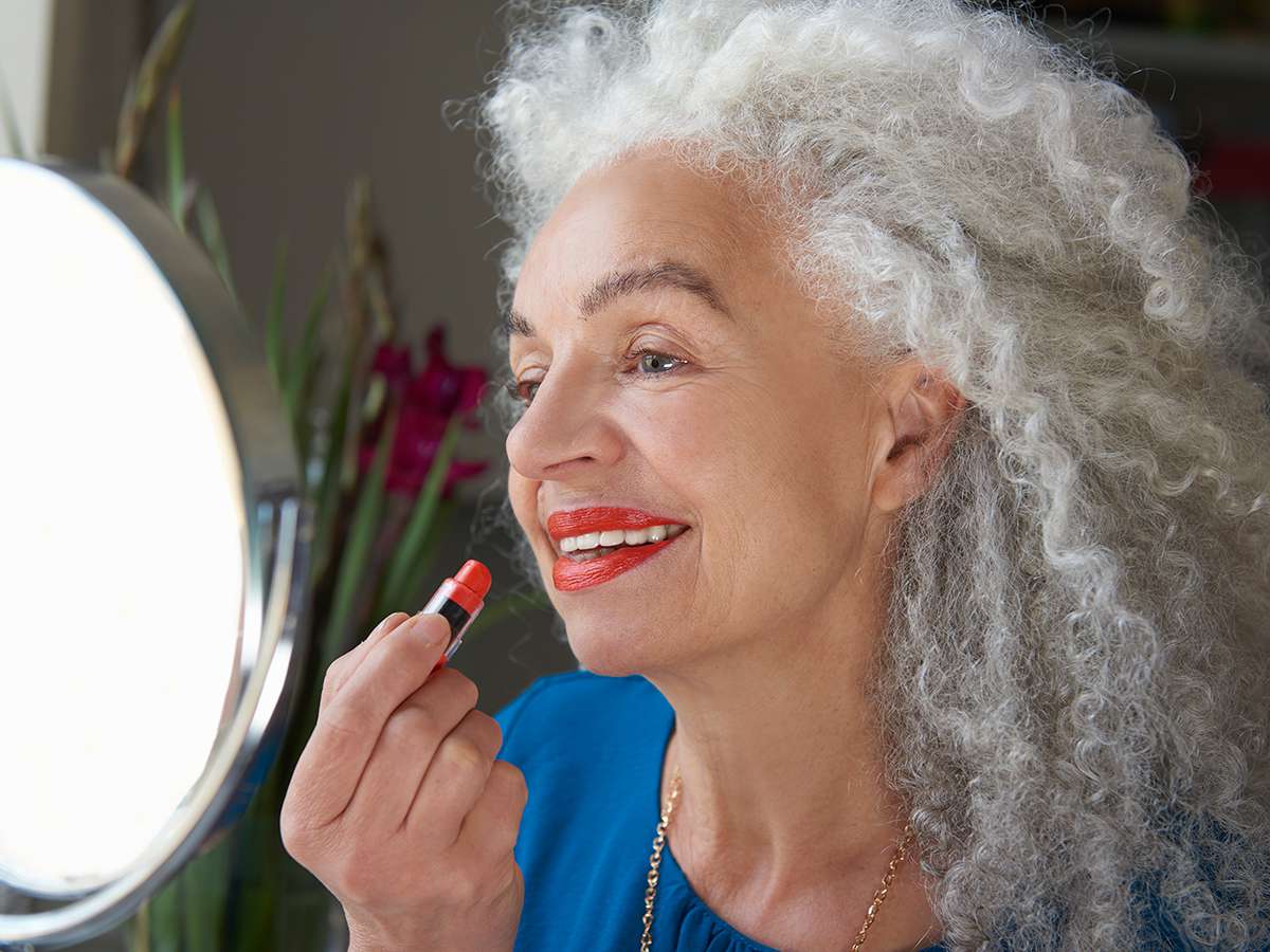 Amazon Customer-Loved Favorites Tout, Senior Woman applying lipstick
