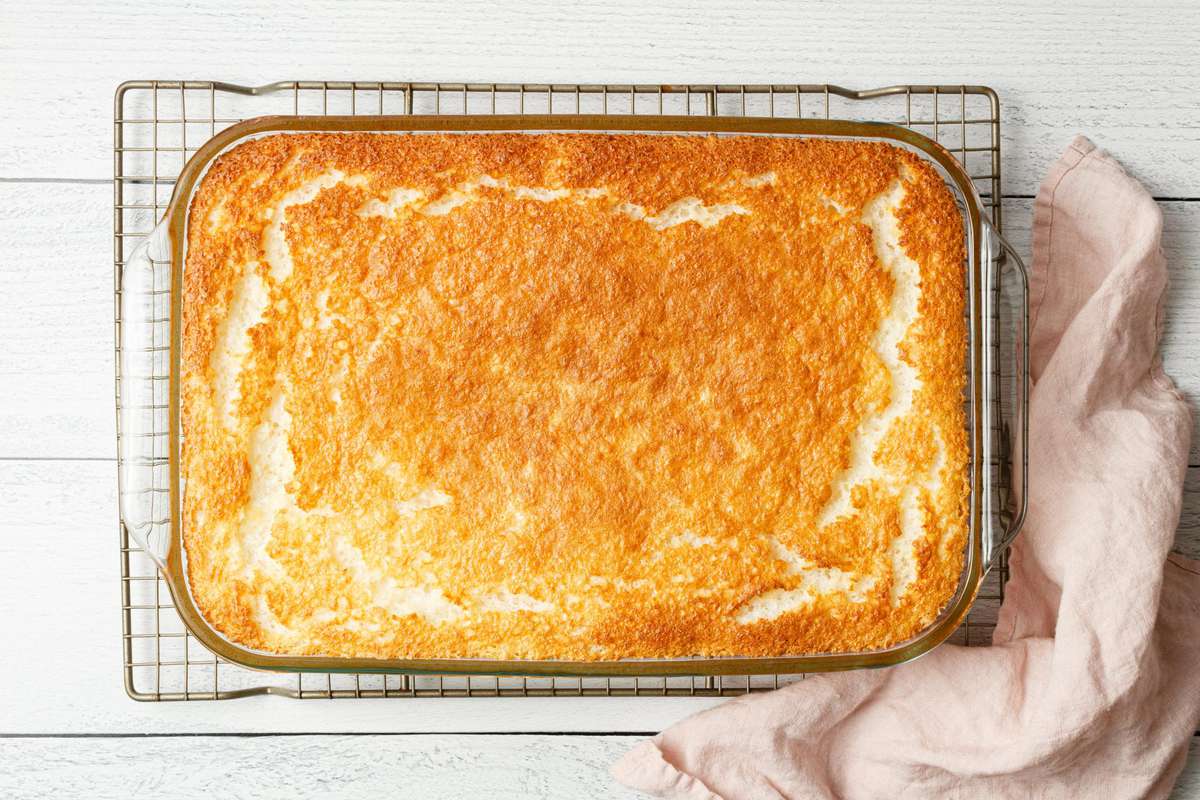 a 9x13 casserole with a golden-brown baked cake