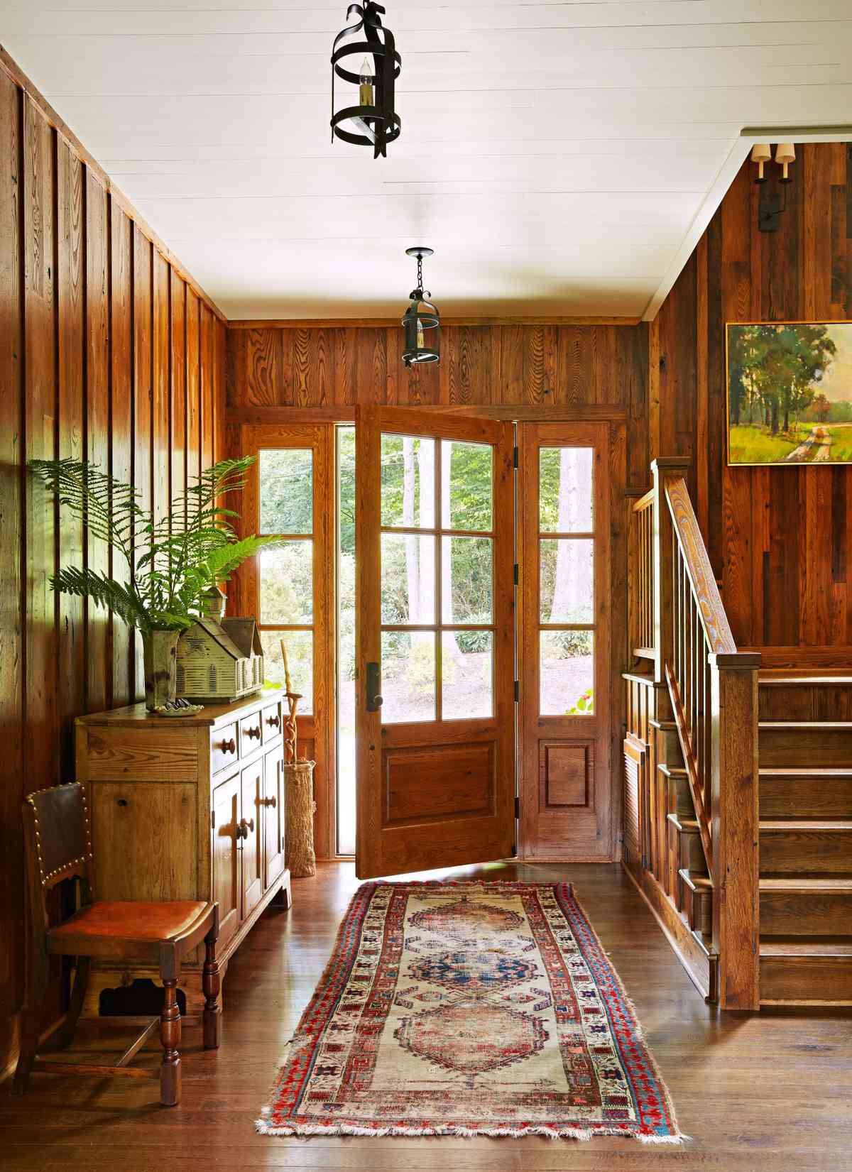 Mountain House Front Entryway with Wood-clad Walls