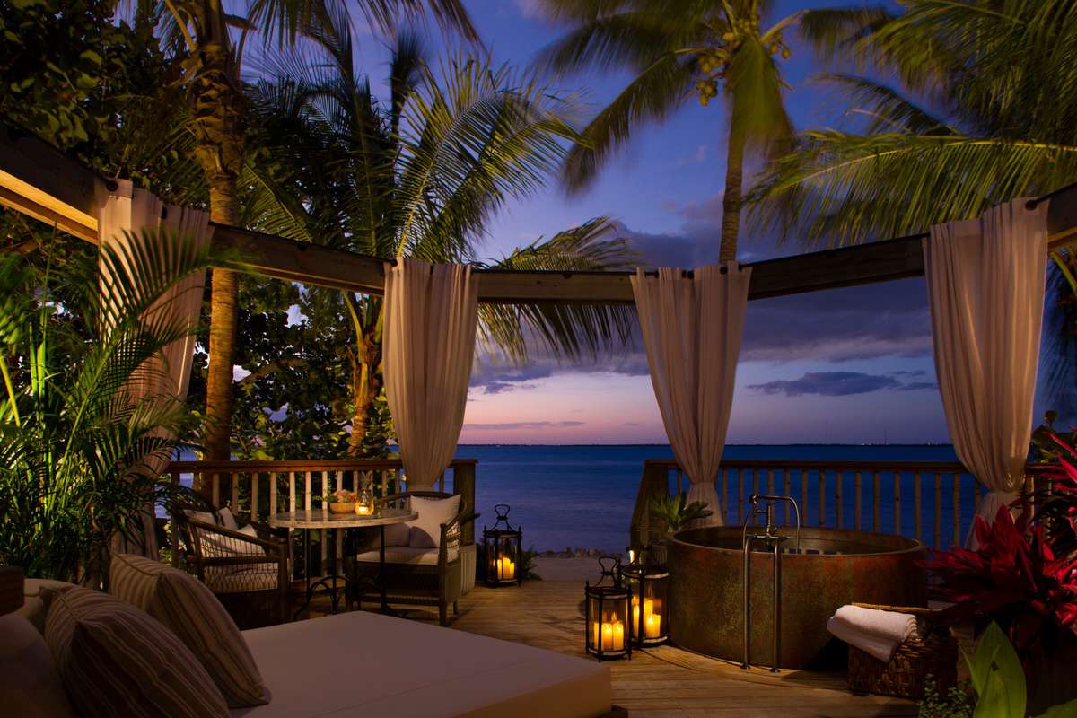 Little Palm Island Resort & Spa beach bungalow at sunset