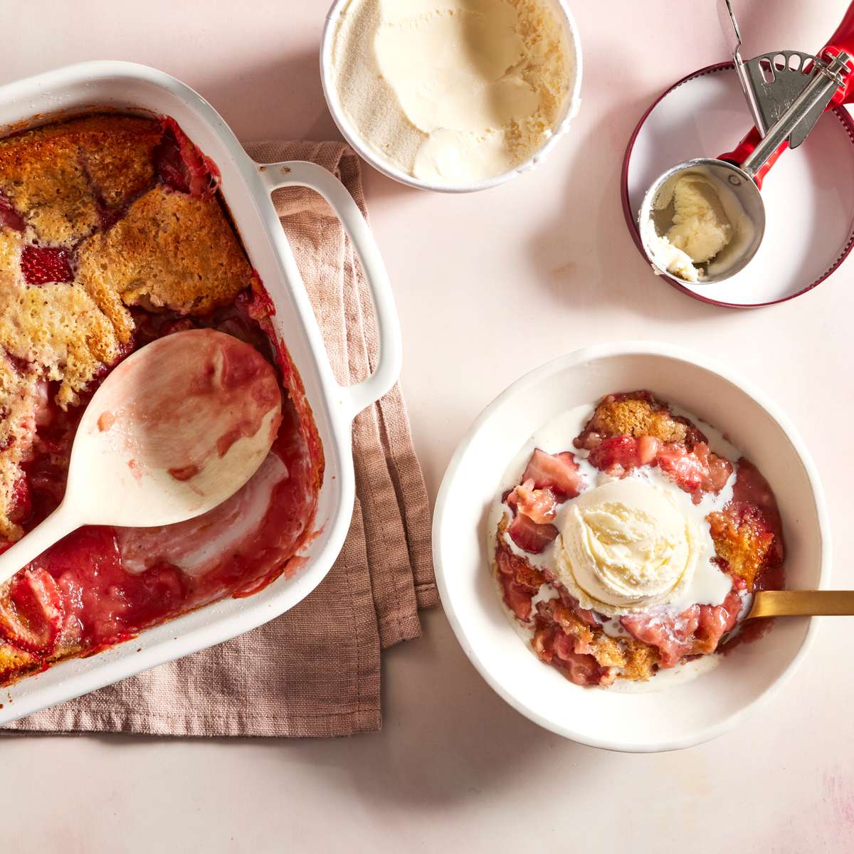Cakey Strawberry Cobbler in a casserole dish and bowl