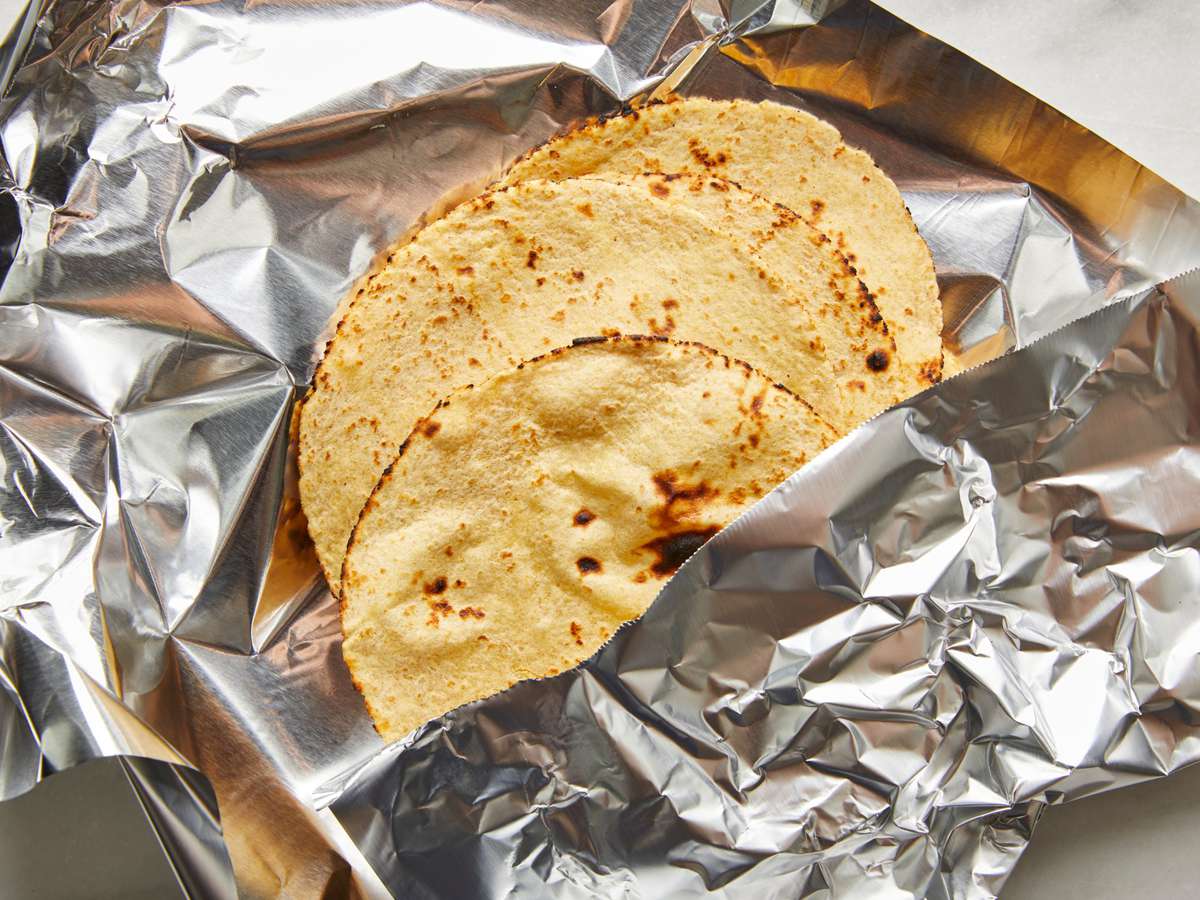 corn tortillas wrapped in aluminum foil