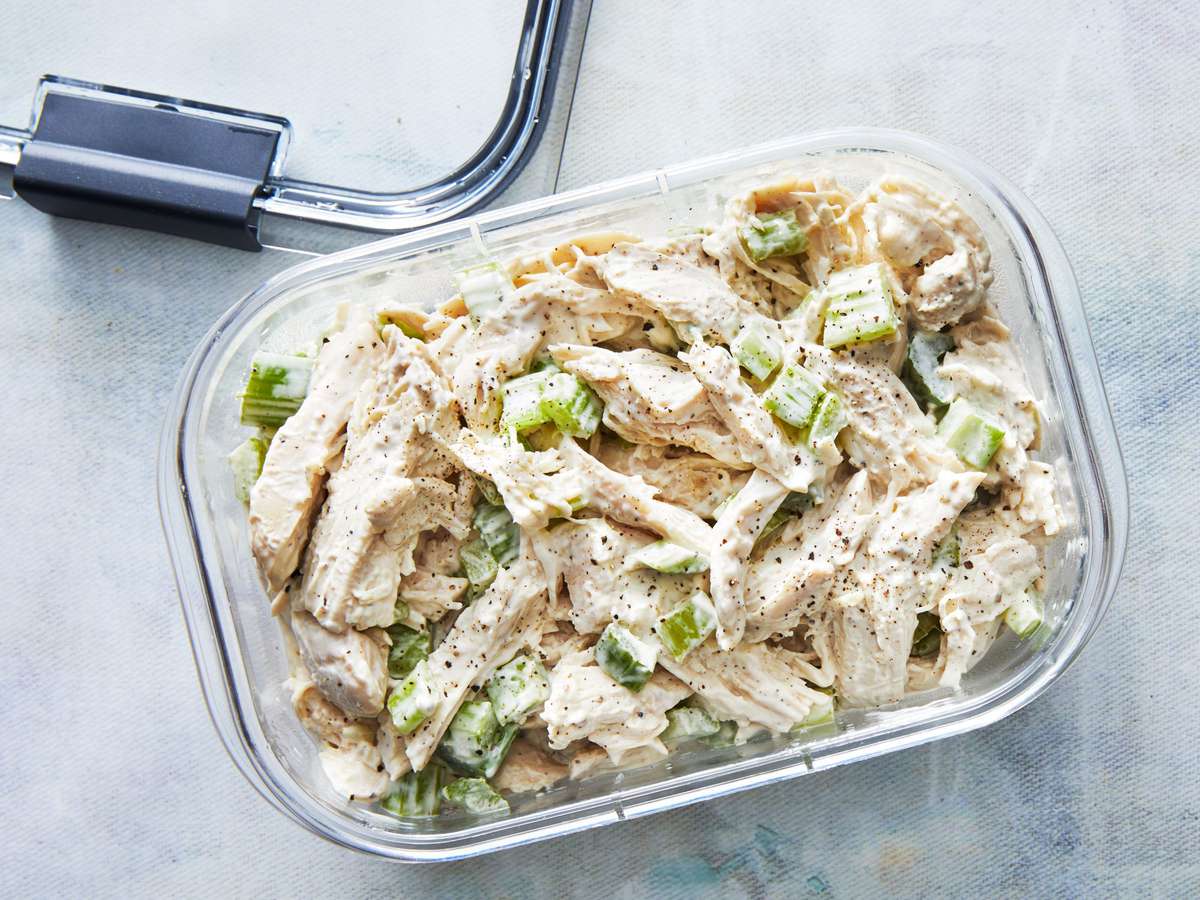 chicken salad in a container with a lid on side