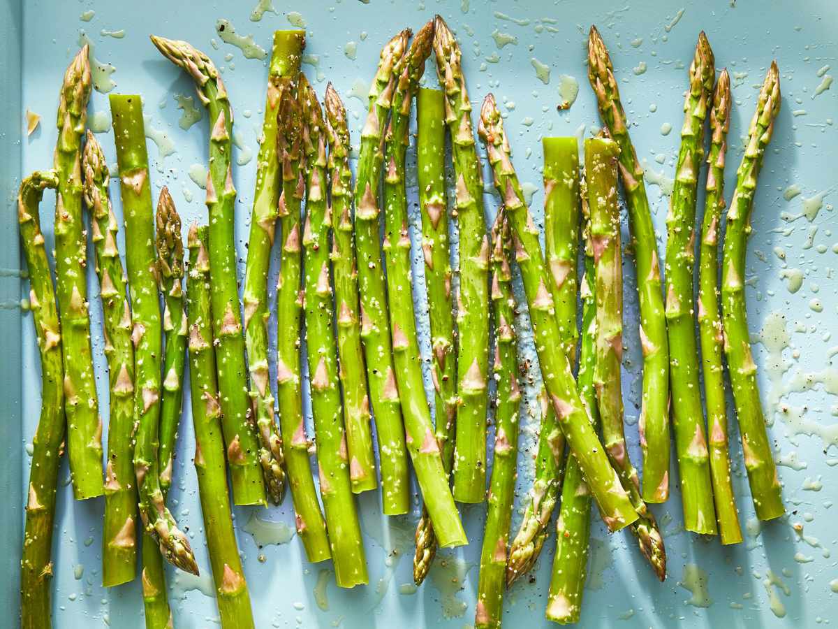 asparagus coated in oil, ready to be grilled