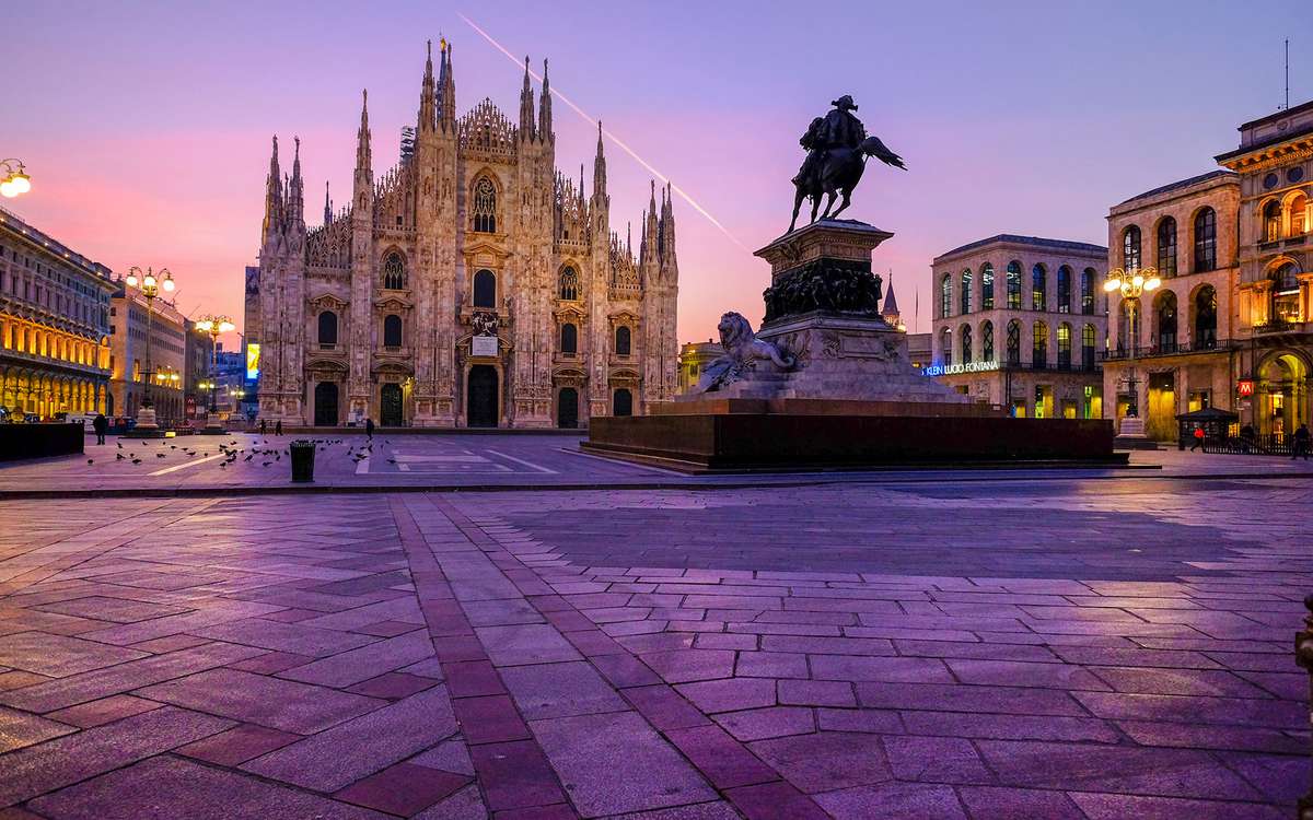 Italy, Milan, Cathedral with equestrian statue Vittorio Emanuele II in the morning