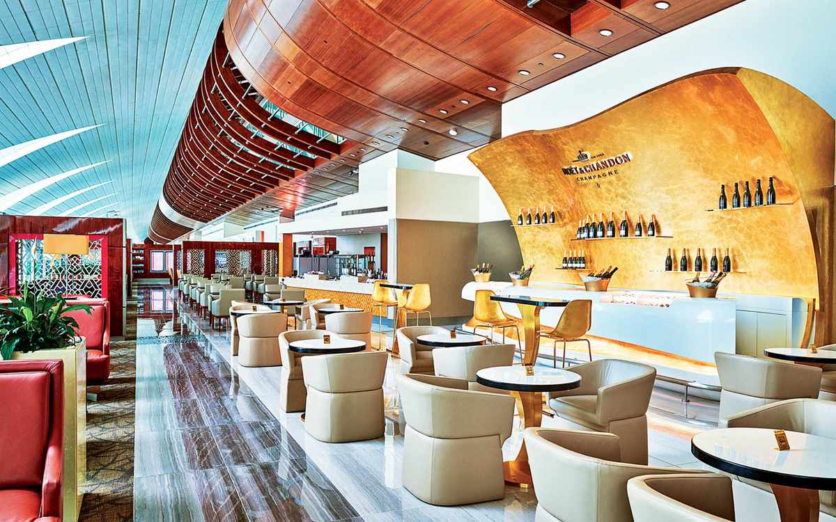 Emirates coach passengers in business/first class lounges