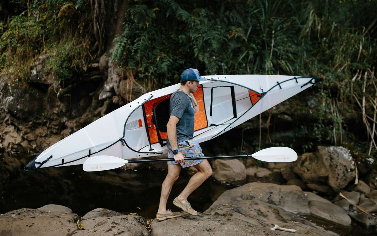 guy carrying built kayak