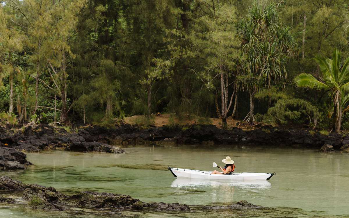 girl kayaking in water