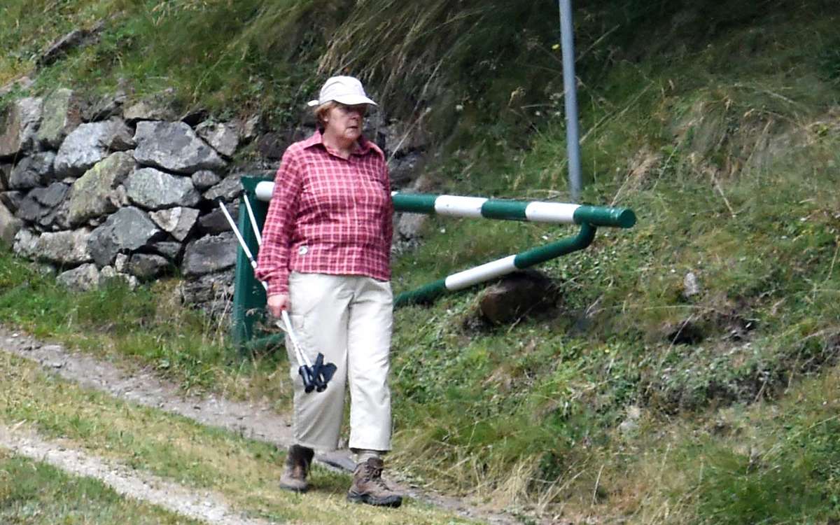 Angela Merkel and her husband Joachim Sauer are seen hiking on July 29, 2015 in Solda, Italy