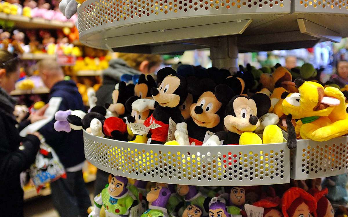 Stuffed toys are displayed at the Disney Store on in New York City retail jobs mickey mouse