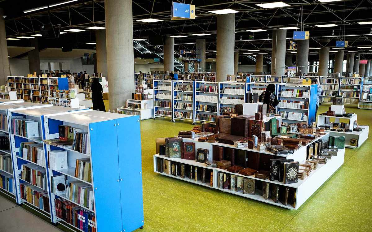 People look at books at Tehran's Book Garden, a new giant academic complex in Iran. The 65,000 square-meter center has several movie theaters, science halls, a restaurant, a prayer room and million books