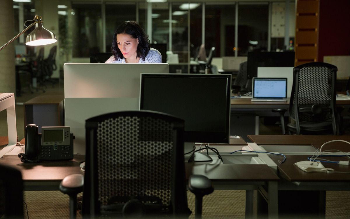 Businesswoman working late at computer in office