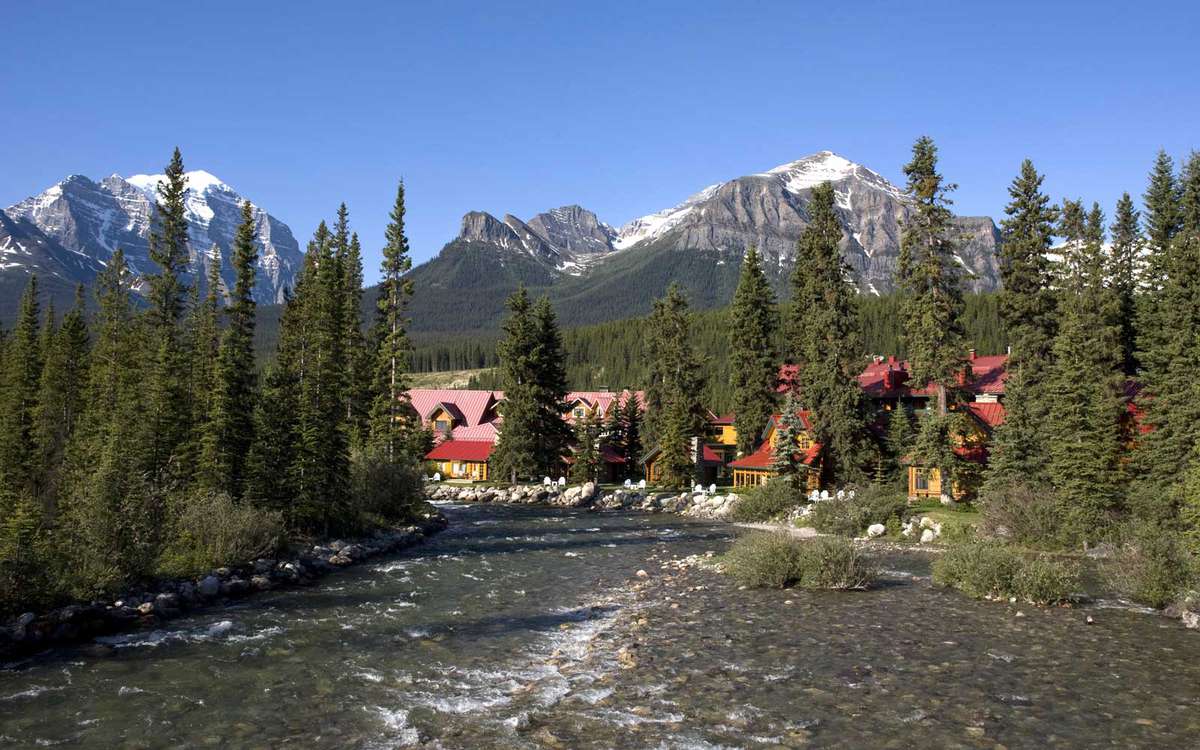 The Post Hotel is nestled along the Bow River at Lake Louise, Canada