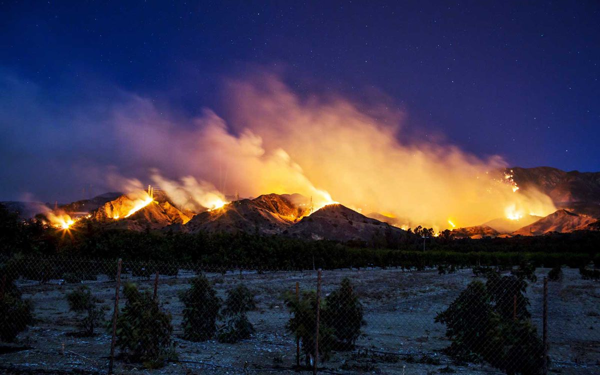 Thomas Fire burns along a hillside near Santa Paula, California
