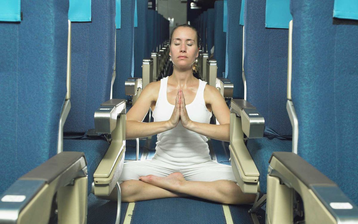 Yoga pose on airplane