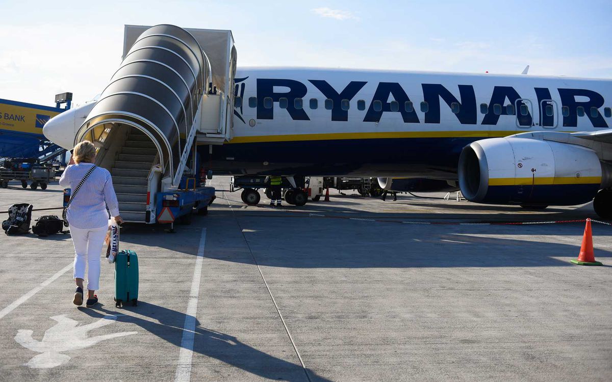 Passengers seen boarding Ryanair aircraft Boeing 737-800 at Krakow John Paul II International Airport.
