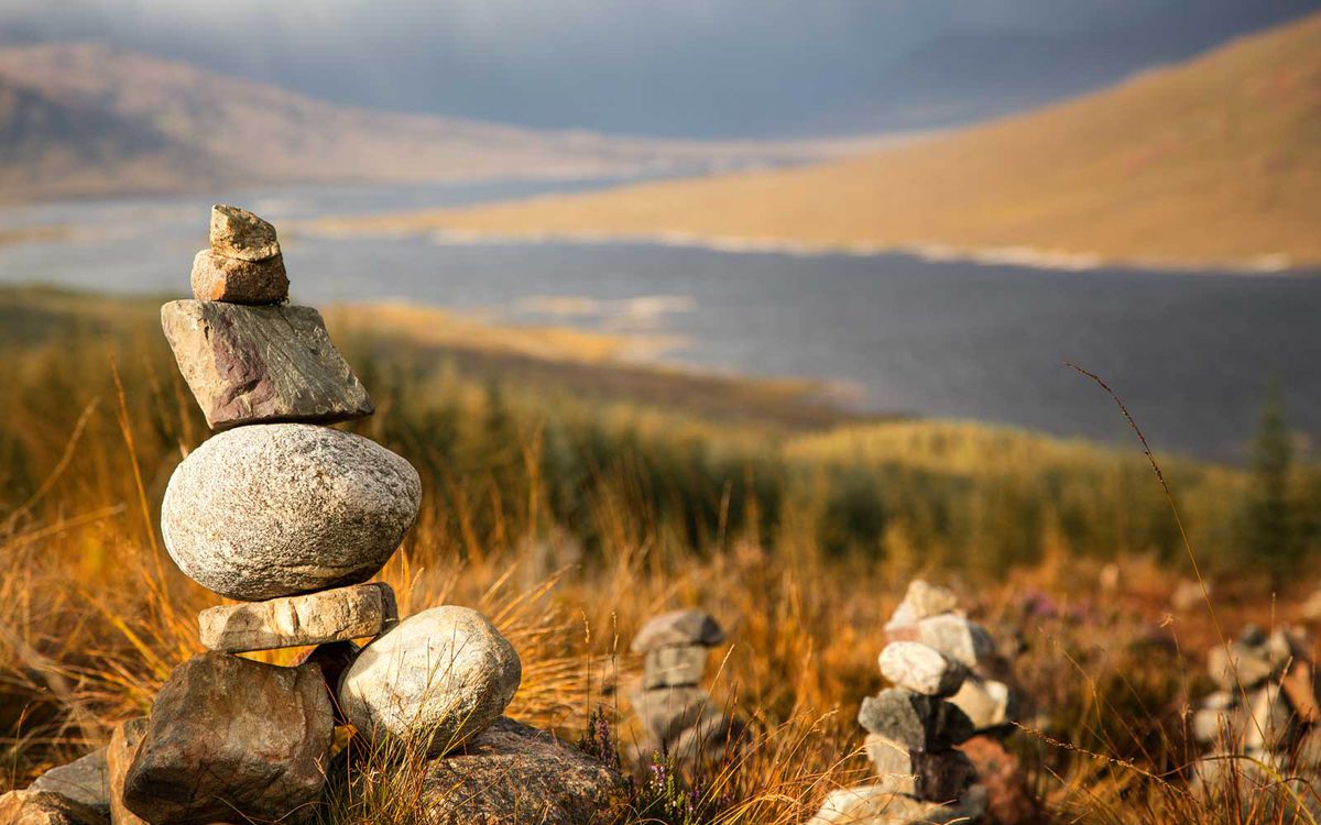 Stone stacks in the Scottish Highlands, overlooking the Ardochy Forest towards Loch Garry, Scotland, UK