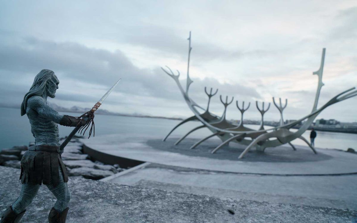 White Walker figurine in Iceland, near a viking ship sculpture