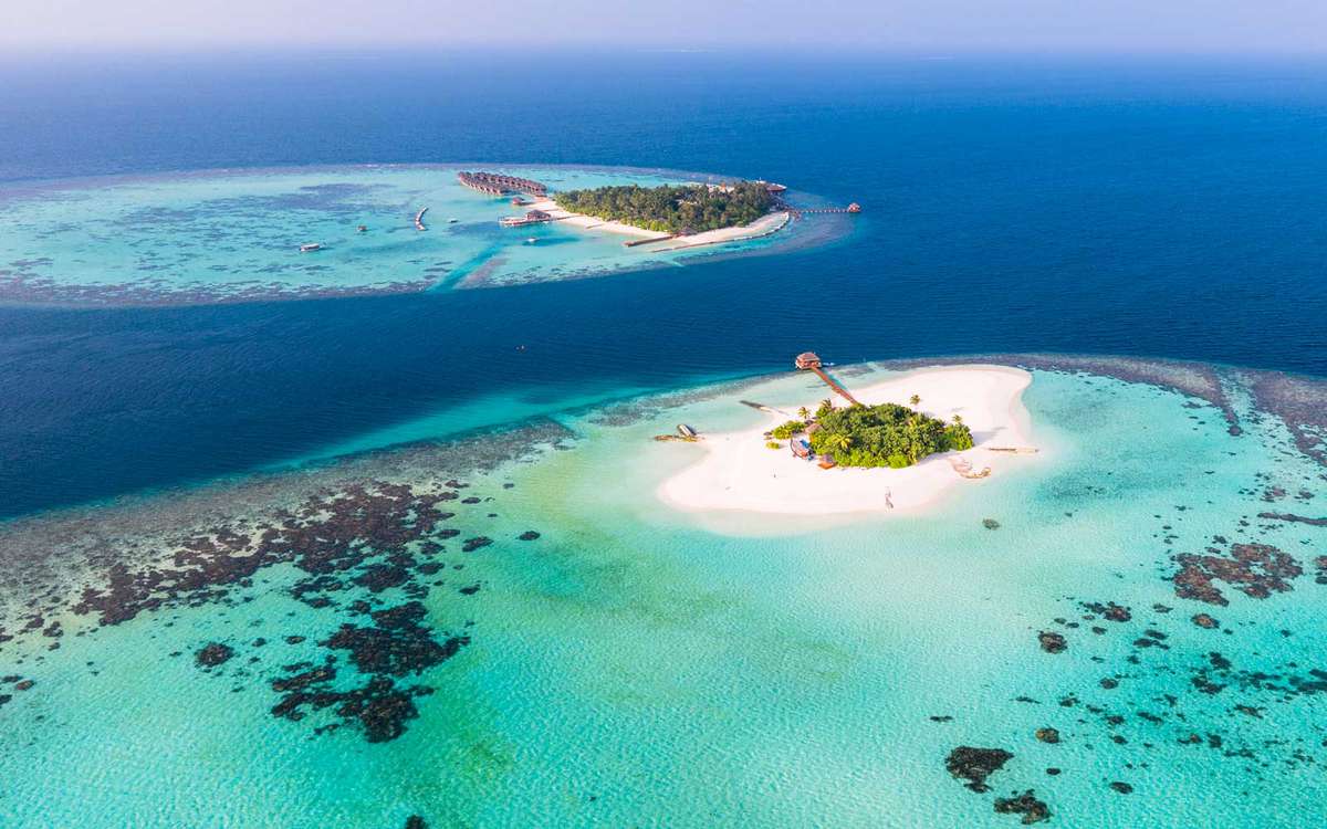 Aerial drone view of a tropical island in the Maldives