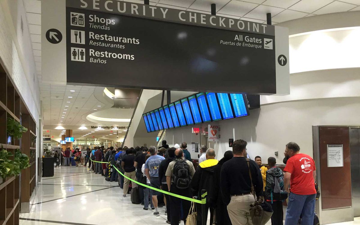 Passengers wait to go through security at the north terminal of the Hartsfield Jackson Atlanta International Airport in Atlanta, Georgia on May 17, 2016.