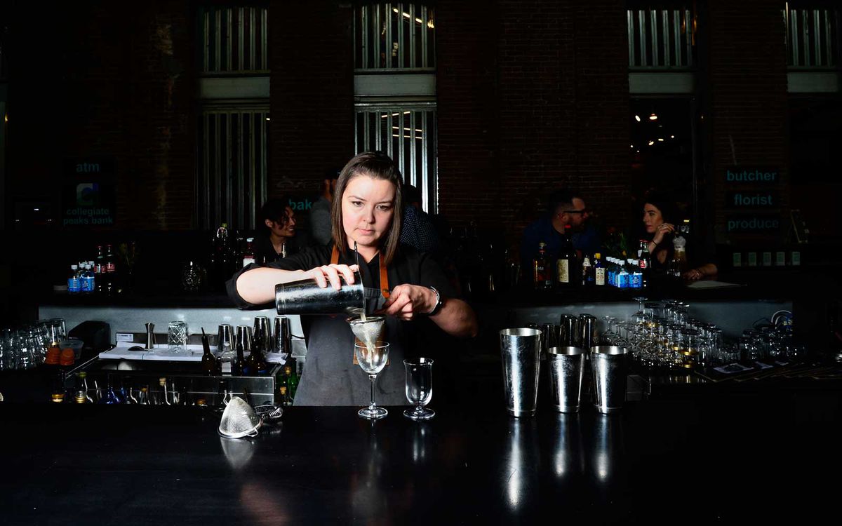 Lauren Lowe mixes up a drink at the RiNo Yacht Club