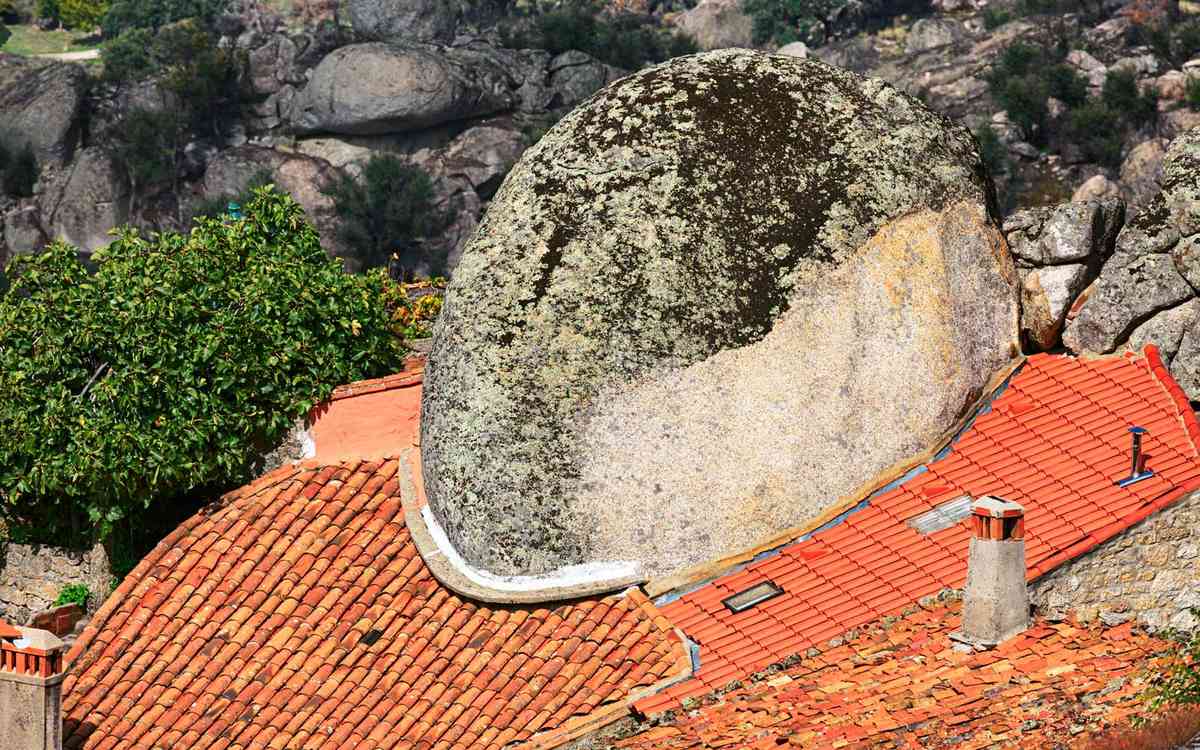 House built around big rock, historic village Monsanto, Portugal