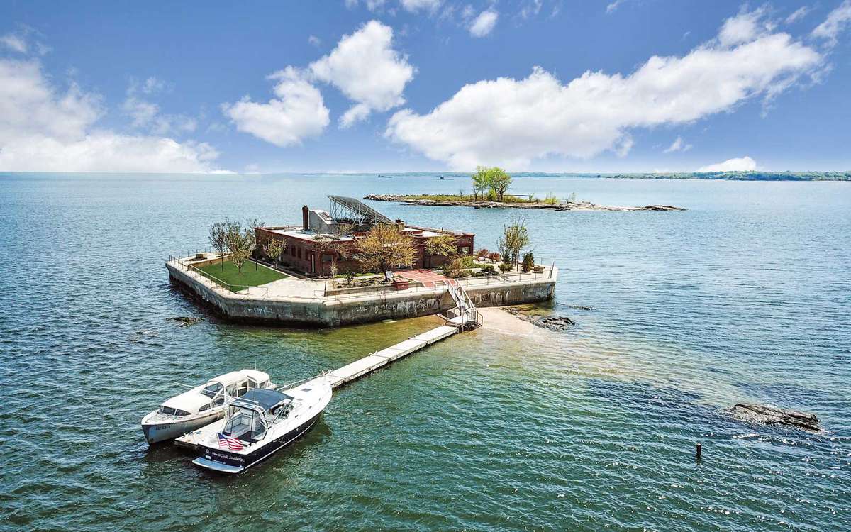 Shot of boat and private residence on private island.