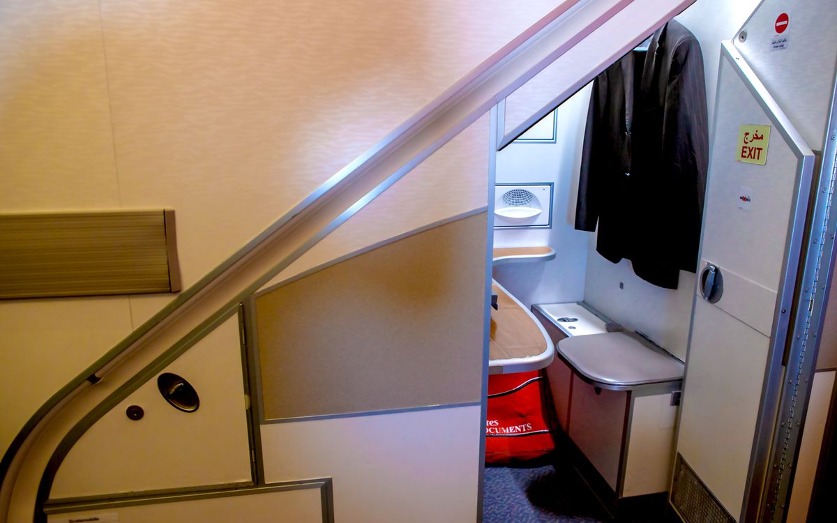 The purser will conduct paperwork in the office located underneath the aircraft's staircase.
