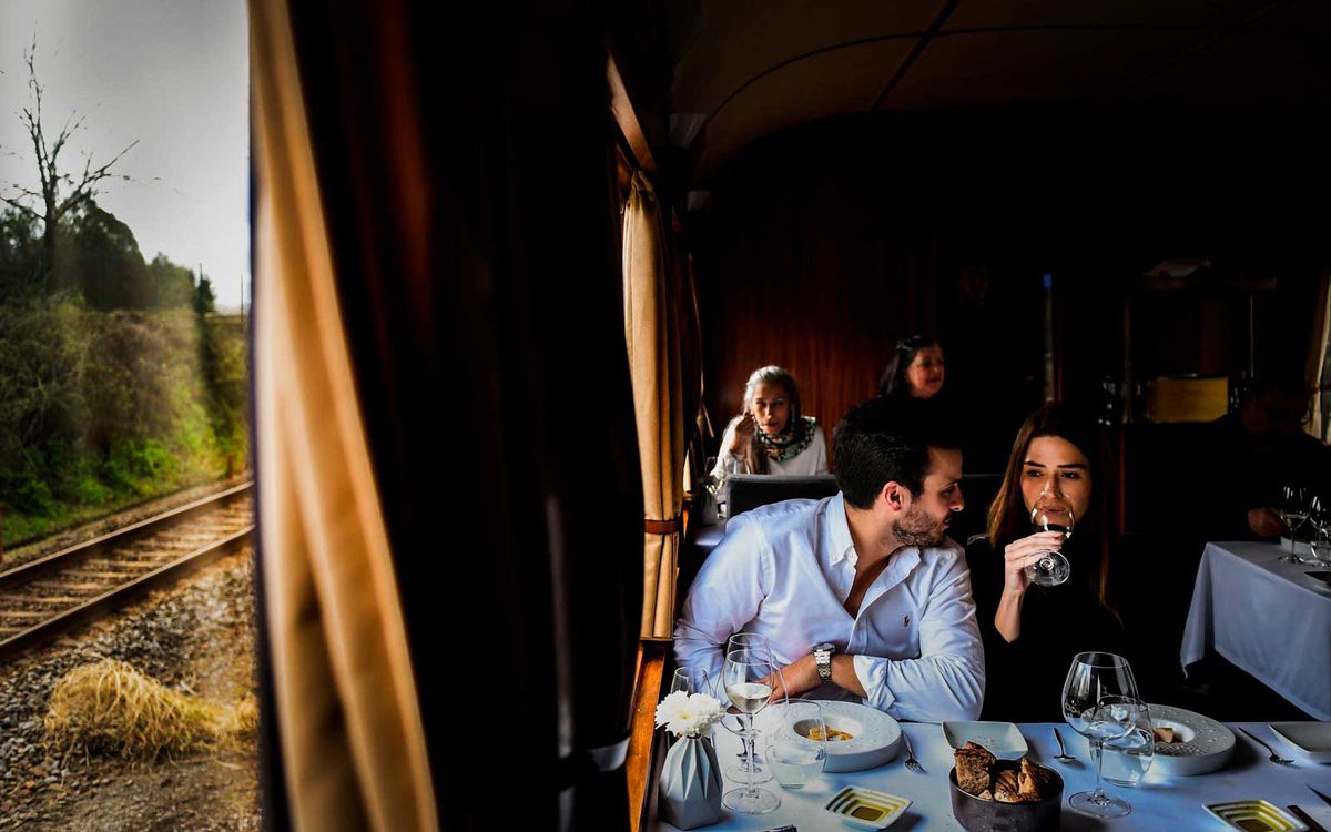 A couple have a meal aboard the Presidential Train during its trip to Douro, north of Portugal, on April 8, 2018.