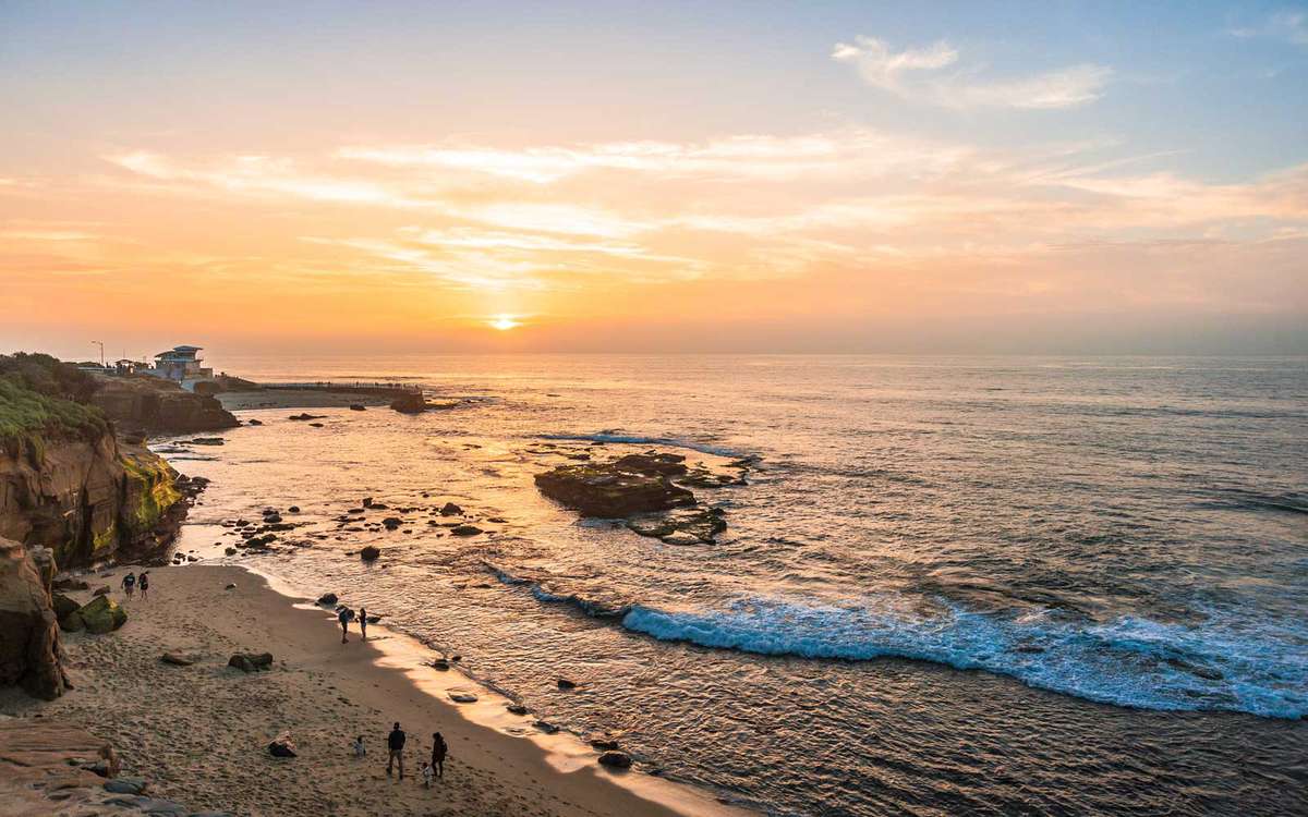 People watching the sunset on the coast of La Jolla, San Diego