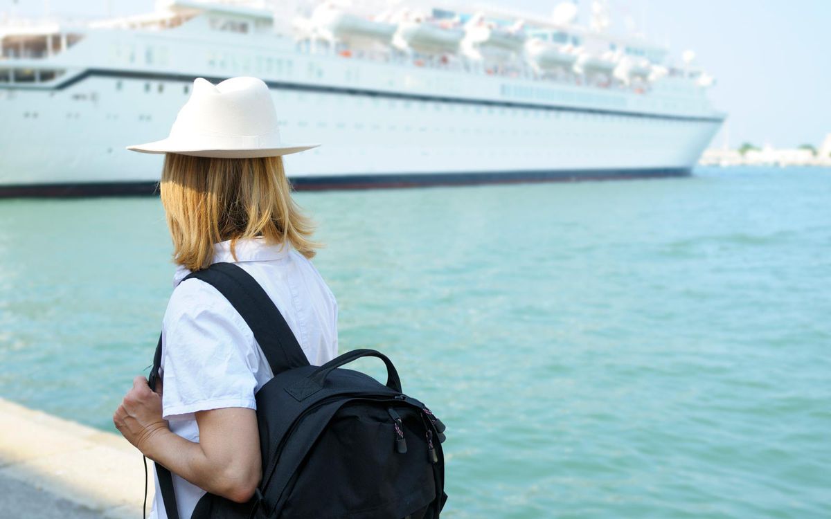 Solo female traveler boarding a cruise
