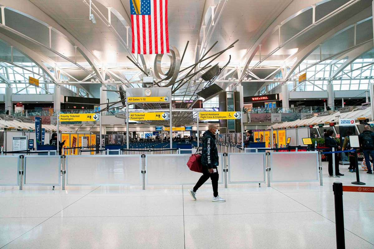 A man walks past counters at the Terminal 1 section at John F. Kennedy International Airport on March 12, 2020 in New York City