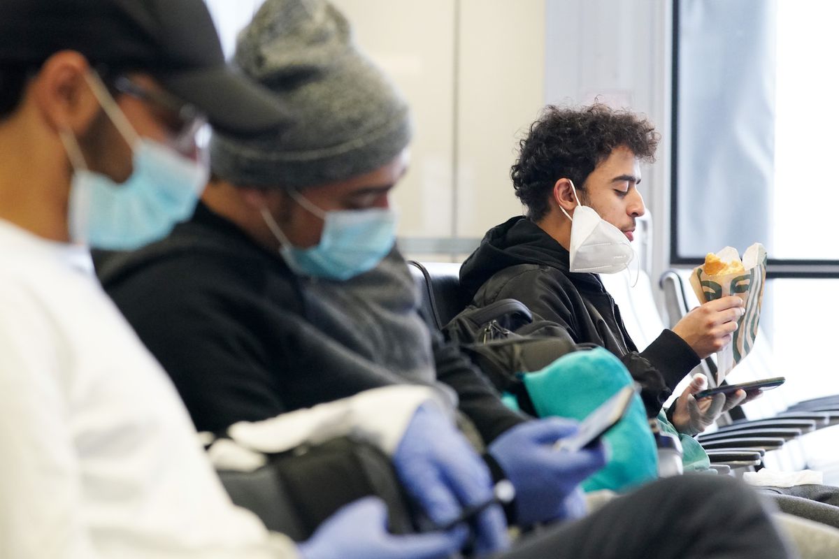 American Airlines passengers wear face masks during coronavirus outbreak