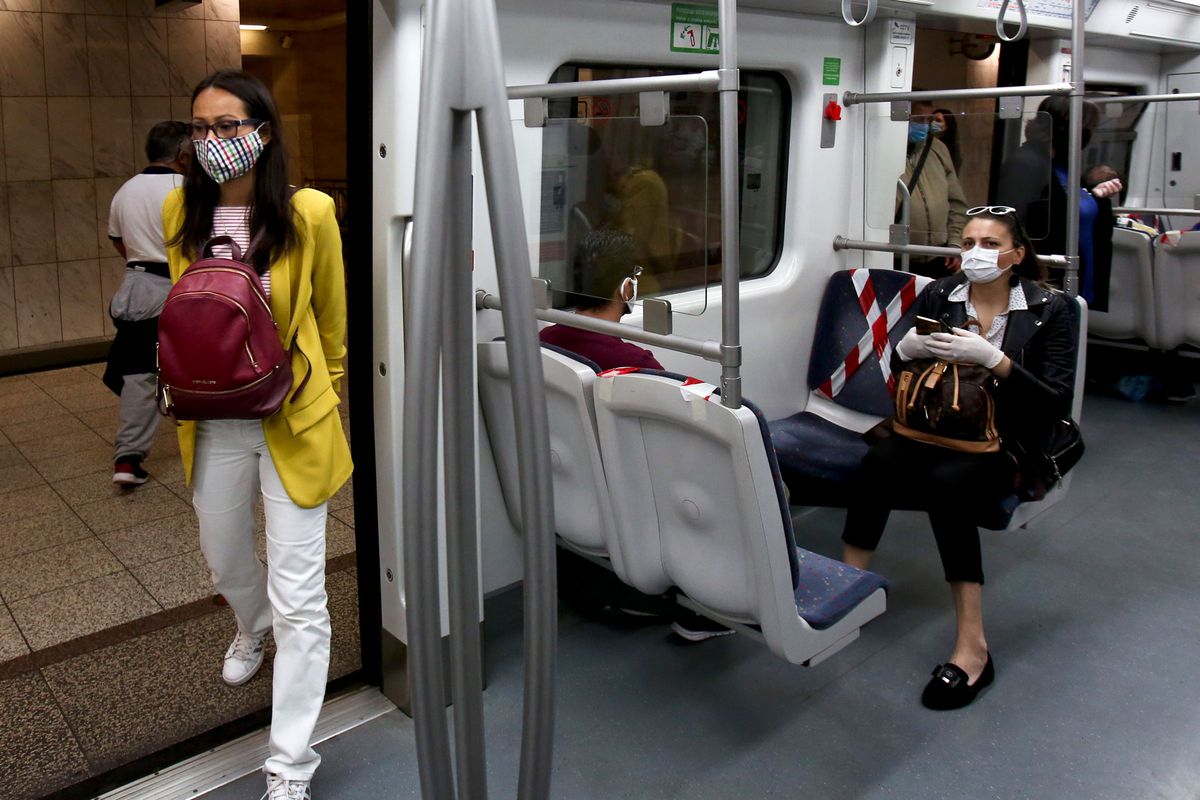 commuters wearing protective face masks on the Greece metro
