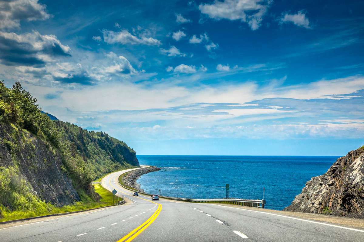 Right by the Saint Lawrence river, a look at beautiful Quebec Route 132, near Cap-au Renard (La Martre) in Haute-Gaspésie, situated in the Eastern part of the Canadian province.