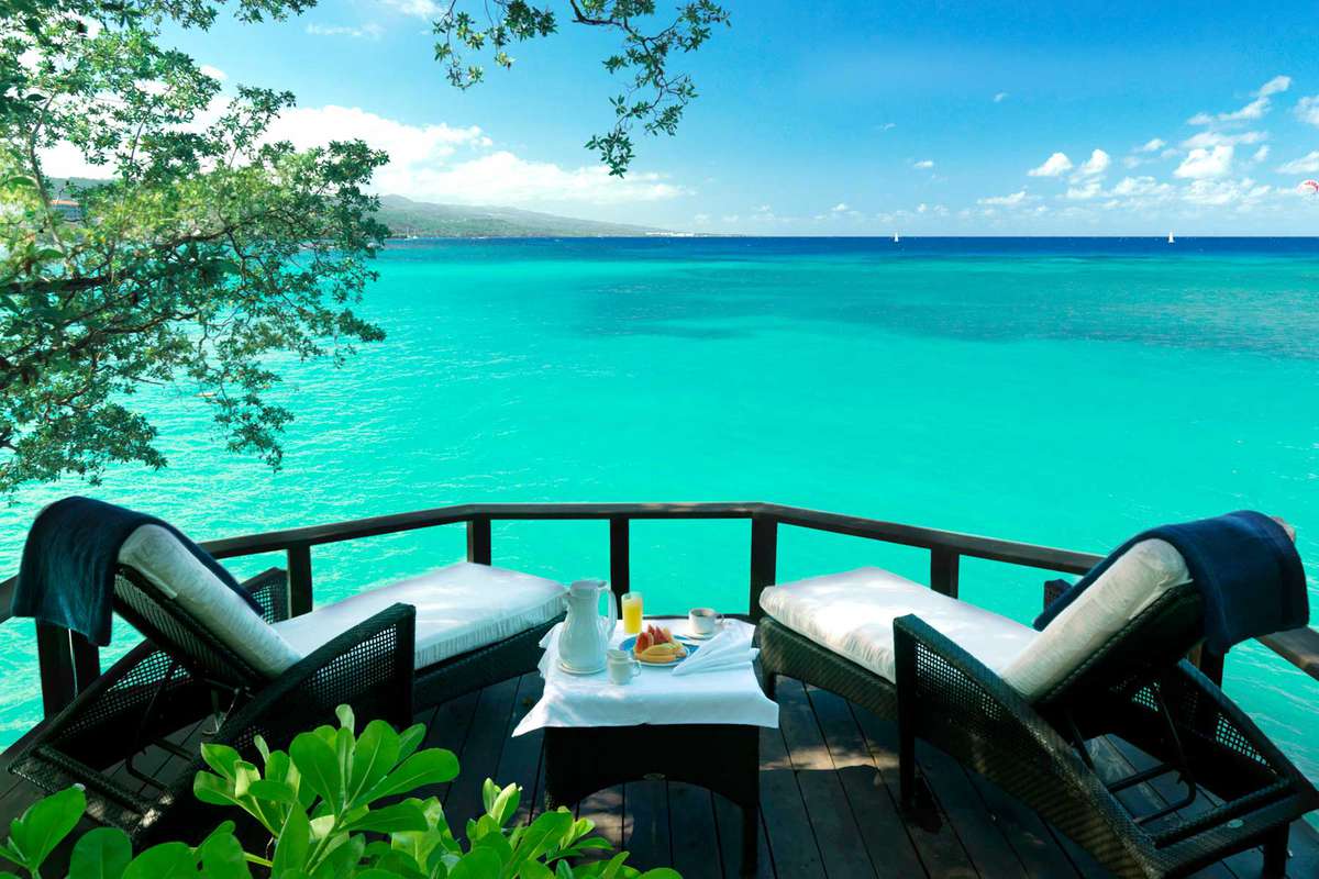 View from a terrace to turquoise water at the Jamaica Inn