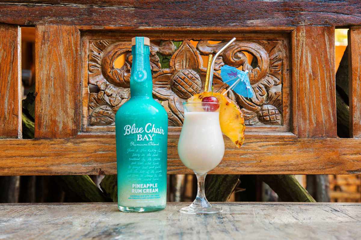 Pina Colada with bottle of Blue Chair Bay Pineapple Rum Cream