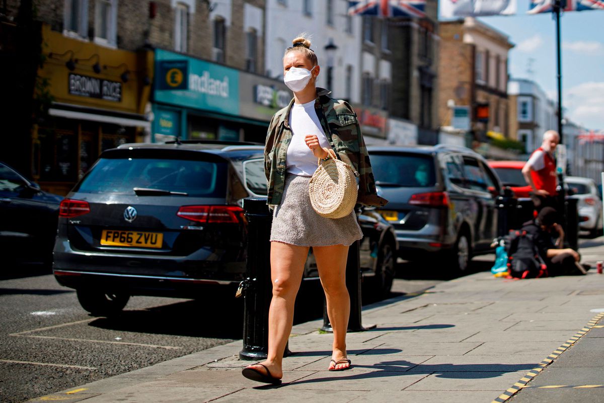 woman wearing face mask walking